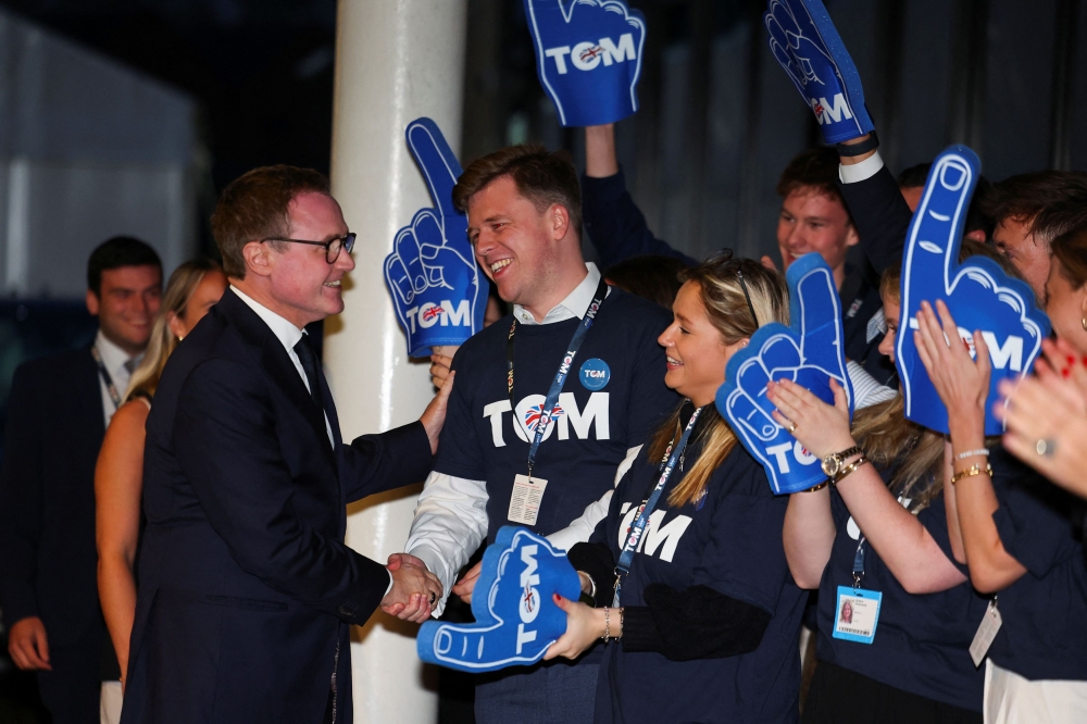 Conservative Party MP and leadership candidate Tom Tugendhat greets people as he arrives at the annual Conservative Party conference in Birmingham. — AFP pic