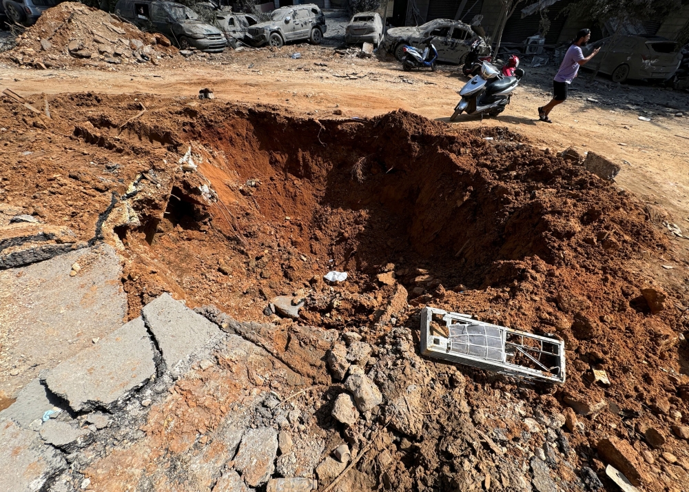 A view shows damage near the site of the Israeli air strike that killed Lebanon’s Hezbollah leader Hassan Nasrallah on Friday, in Beirut’s southern suburbs, Lebanon, September 29, 2024.  — Reuters pic 