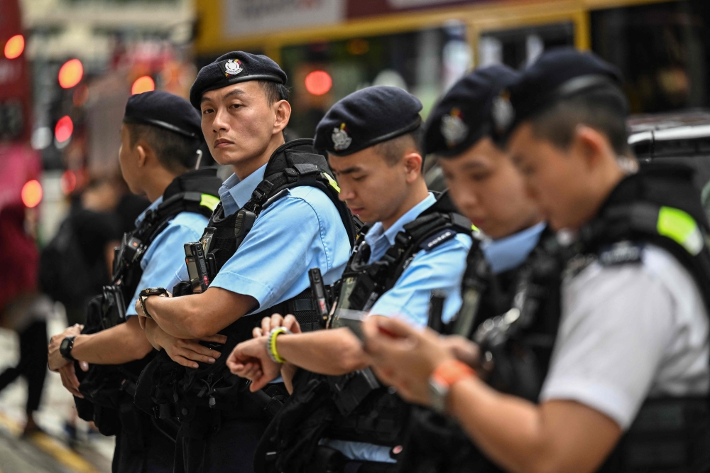File picture of Hong Kong police. Police arrested 185 people in a three-day citywide crackdown on triad-related activities and violent crime, authorities announced on Monday. — AFP pic   