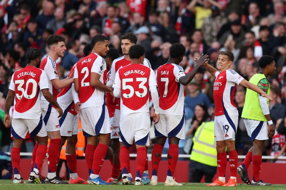 Arsenal celebrate after scoring their third goal during the English Premier League football match between Arsenal and Leicester City at the Emirates Stadium in London on September 28, 2024. — AFP pic