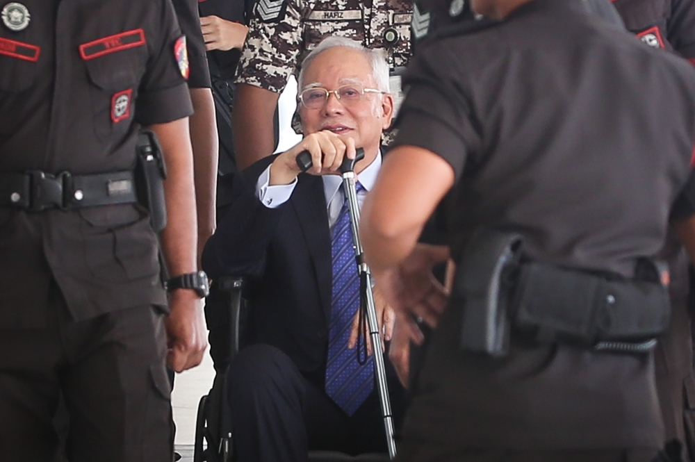 Former prime minister Datuk Seri Najib Razak is pictured in a wheelchair at the Kuala Lumpur High Court Complex September 30, 2024. — Picture by Yusof Mat Isa