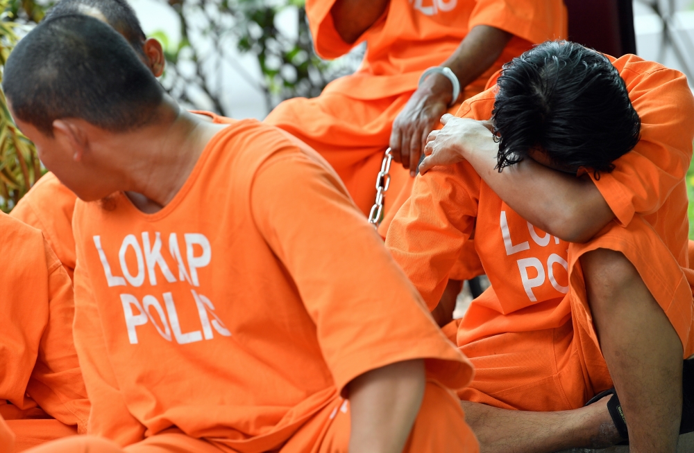 A file photograph shows suspects awaiting a remand hearing for the investigation linked to GISB Holdings Sdn Bhd, in Shah Alam on Sept 22, 2024. — Bernama pic