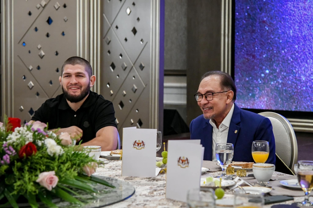 Prime Minister Datuk Seri Anwar Ibrahim and Khabib Nurmagomedov (left) sit together at Seri Perdana in Putrajaya, on Sept 30, 2024. — Picture from Facebook/Anwar Ibrahim