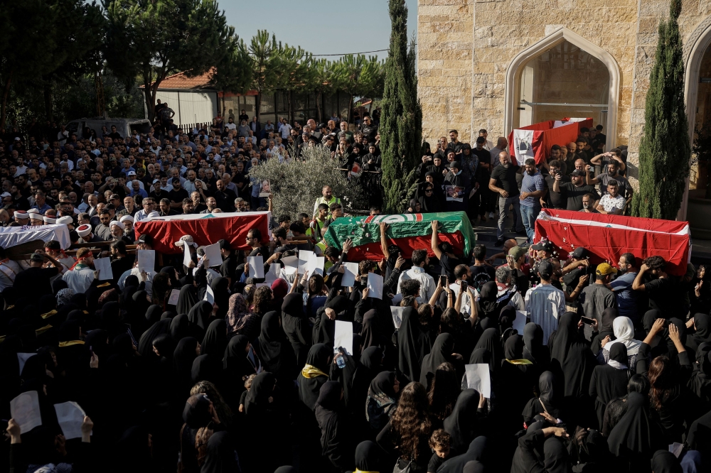 A funeral procession of villagers killed in an Israeli strike on residential buildings in Maaysrah, north of Beirut, Lebanon, September 27, 2024. — Reuters pic