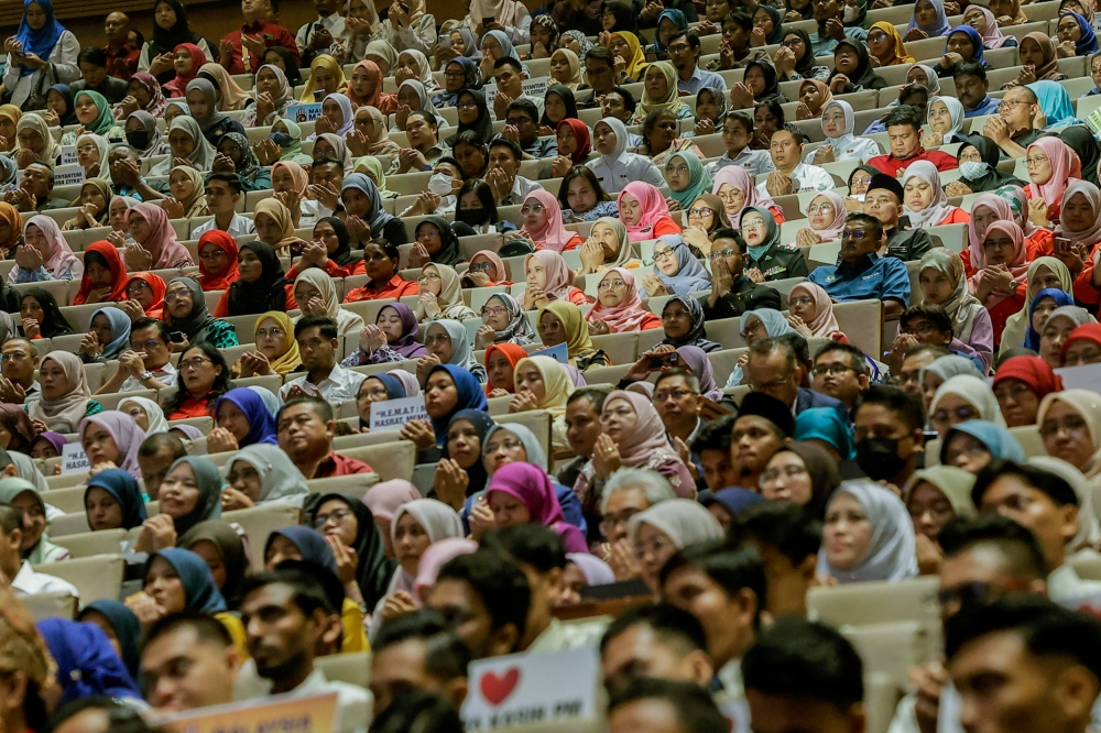 File picture of civil servants attending the a Madani programme at Putrajaya International Convention Centre June 14, 2024. More than 40,000 civil servants in the country are at high risk of experiencing psychological health issues that require immediate intervention to avoid mental disorders, said PSD director-general Tan Sri Wan Ahmad Dahlan Abdul Aziz. — Picture by Hari Anggara