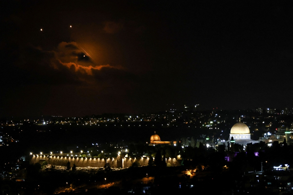 The Dome of the Rock on the Al-Aqsa compound, also known to Jews as the Temple Mount is seen as projectiles fly through the sky, after Iran fired a salvo of ballistic missiles at Israel, as seen from Jerusalem October 1, 2024. — Reuters pic