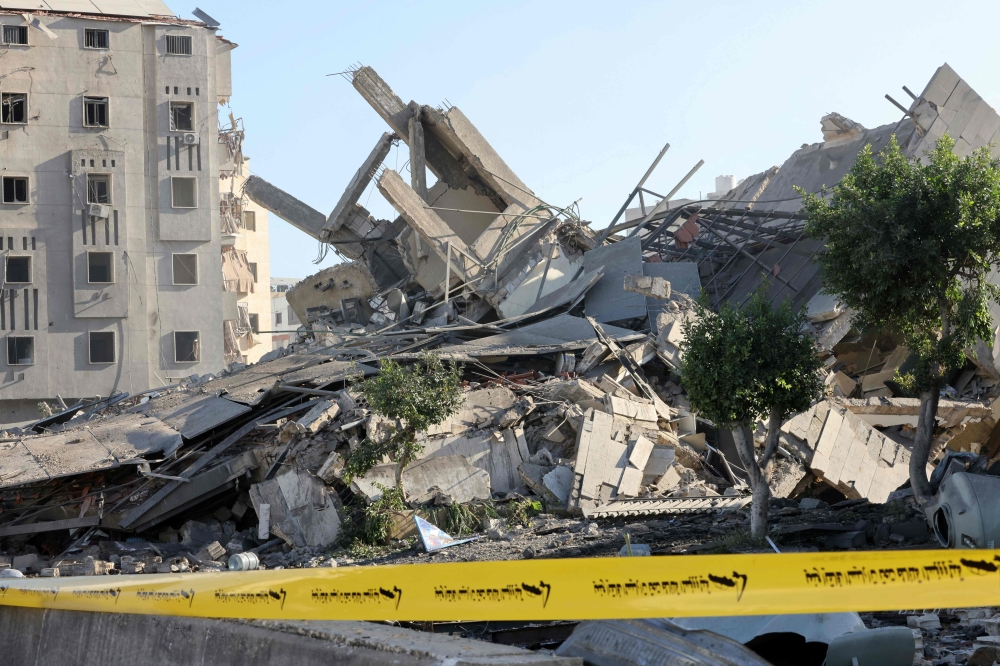 The rubble from a destroyed building is cordoned off at the site of an overnight Israeli airstrike in Beirut's southern suburb Tiro neighbourhood on October 2, 2024. — AFP pic