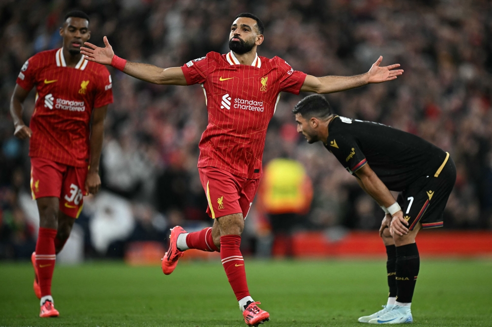 Liverpool’s Mohamed Salah celebrates scoring the team’s second goal during the Uefa Champions League against Bologna in Liverpool October 2, 2024. — AFP pic