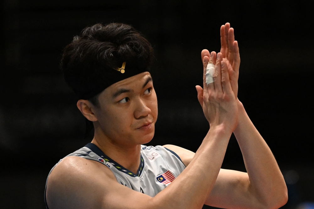 Lee Zii Jia acknowledged that his position is still unsafe in the race to qualify for the BWF World Tour Finals in Hangzhou, China, this December. — AFP file pic