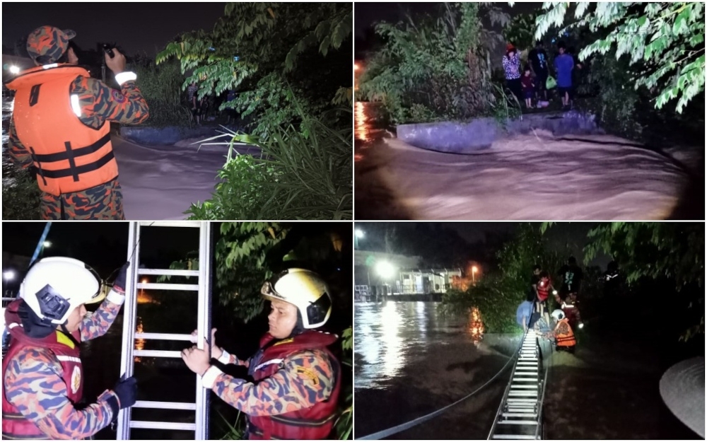 The team from the Fire Department used the ‘river crossing’ technique to assist the victims in crossing the river. — Picture from Facebook/Bernama Radio 