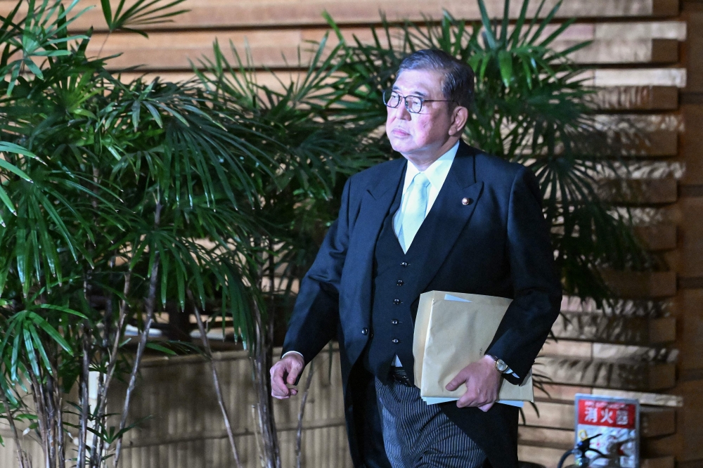 Japan’s new Prime Minister Shigeru Ishiba leaves the prime minister’s office to attend a ceremony with the emperor in Tokyo on October 1, 2024. — AFP pic 