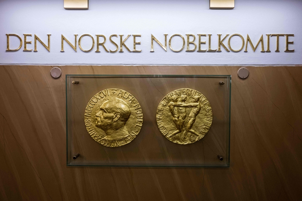 A photo taken on September 25, 2024 in Oslo, Norway shows replicas of the obverse and reverse of the Nobel Peace Prize medal displayed at The Norwegian Nobel Institute. — AFP pic