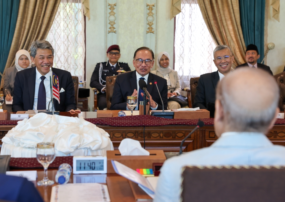 Prime Minister Datuk Seri Anwar Ibrahim (centre) with Pakistan Prime Minister Shehbaz Sharif (not pictured) during a bilateral meeting on a state visit at the Official Residence of the Prime Minister of Pakistan in Islamabad October 3, 2024. Also present are Foreign Minister Datuk Mohamad Hasan (left) and Investment, Trade and Industry Minister Datuk Seri Tengku Zafrul Abdul Aziz (right). — Bernama pic