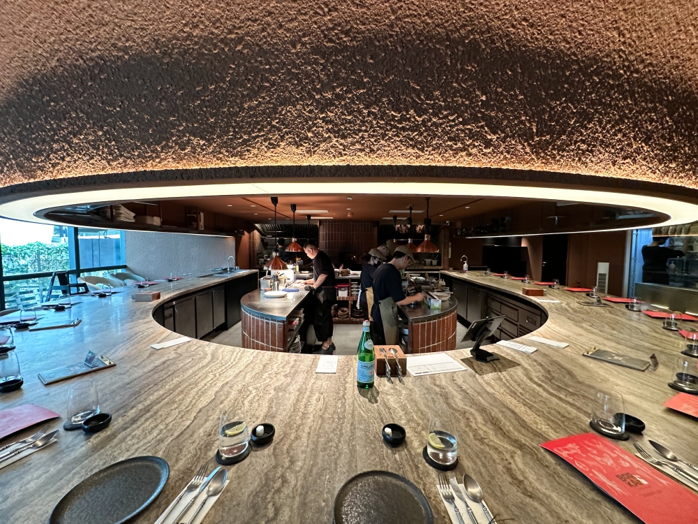 Bar.Kar, the casual offshoot of Eat and Cook, has diners sitting around the action where the grilling takes place — Picture by Lee Khang Yi 