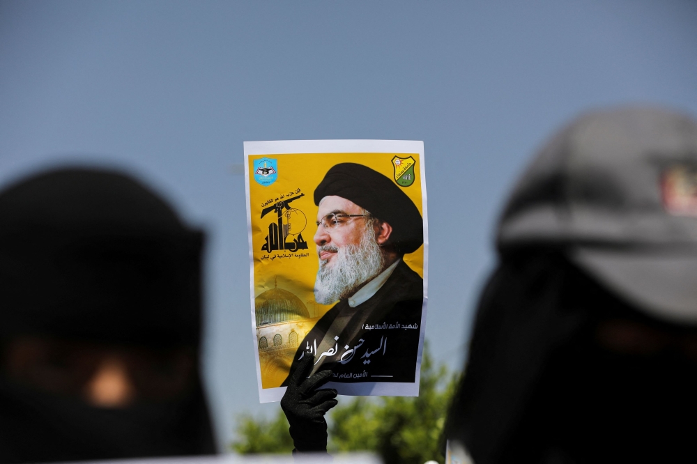 A student holds a poster of Hassan Nasrallah, the assassinated chief of Lebanon’s Hezbollah, during a rally in Sanaa, Yemen October 2, 2024. — Reuters pic