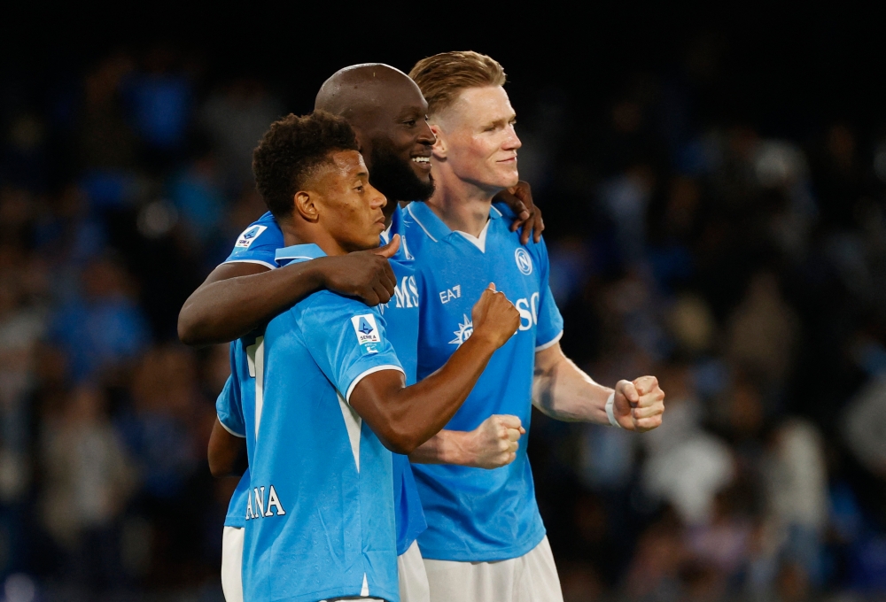 Napoli's (left to right) David Neres, Romelu Lukaku and Scott McTominay celebrate after the match with Como. — Reuters pic