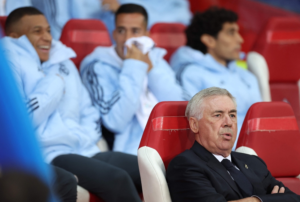 Real Madrid's Italian coach Carlo Ancelotti (R) reacts on the bench during the UEFA Champions League football match between Lille LOSC and Real Madrid at the Pierre Mauroy Stadium in Villeneuve-d'Ascq, northern France, on October 2, 2024. — AFP pic