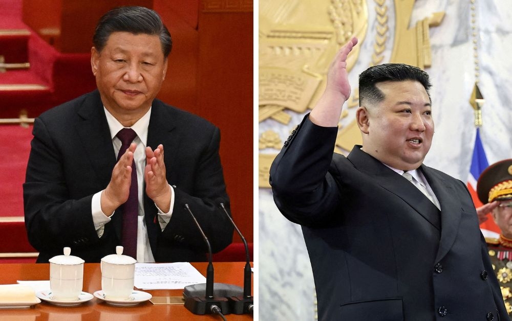 Chinese President Xi Jinping today told his North Korean counterpart Kim Jong-un that Beijing hoped to ‘deepen friendly... cooperation’ with Pyongyang, as the two leaders exchanged messages to mark a major diplomatic anniversary. — Combination pic from AFP and KCNA via Reuters 