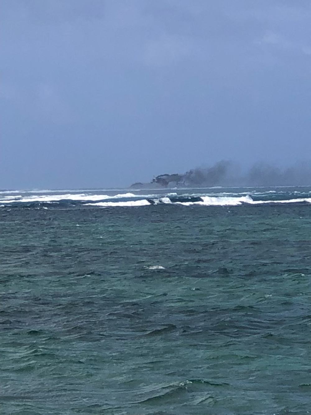 A view of a New Zealand Navy vessel on fire, as seen from Tafitoala, Samoa, October 6, 2024, in this picture obtained from social media. — Dave Poole/Pool pic via Reuters  