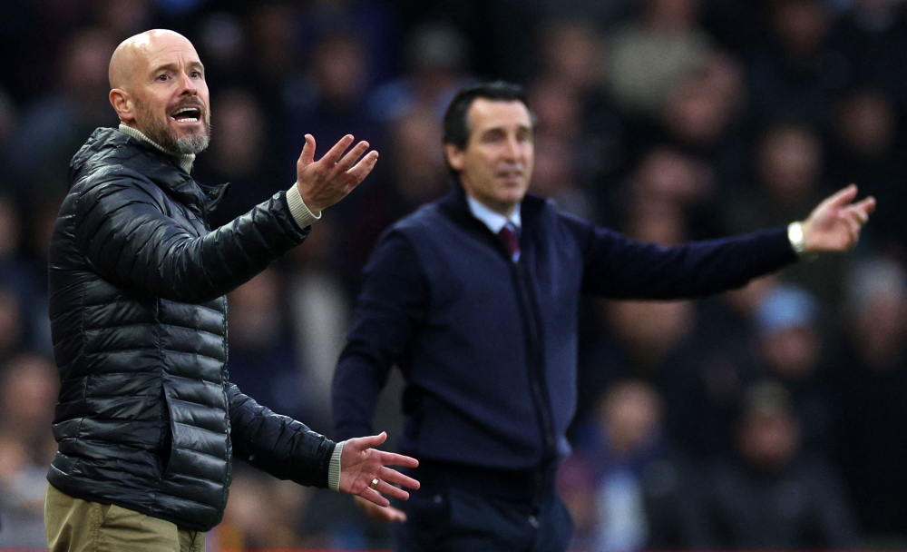 Manchester United’s Dutch manager Erik ten Hag and Aston Villa’s Spanish head coach Unai Emery react during the English Premier League football match between Aston Villa and Manchester United at Villa Park in Birmingham, on October 6, 2024. — AFP pic 