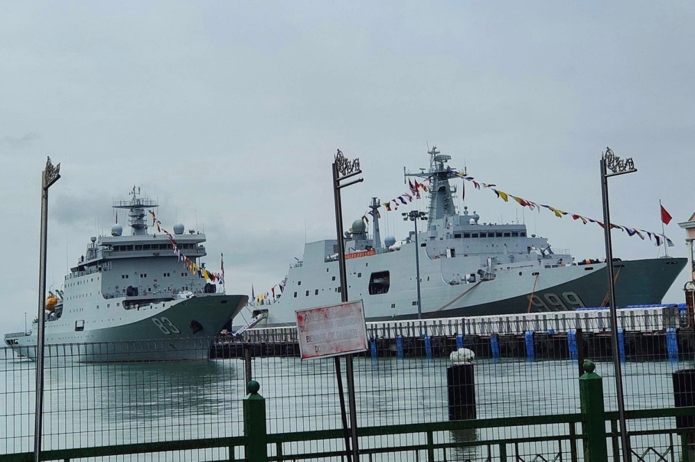 PLA Navy naval training ship Qi Jiguang (left) and amphibious dock landing ship JingGangShan docked at Penang Port. — Picture from Facebook/Garrick Moh