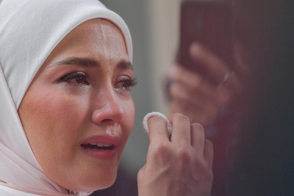 Fazura, who was in tears after the proceedings, said she was not sad about the divorce itself. — Picture from Bernama