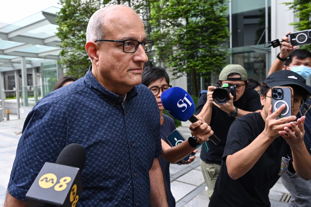 Singapore’s former Minister for Transport and Minister-in-charge for Trade Relations S. Iswaran arrives at the State Court for the start of his 12-month jail sentence in Singapore on October 7, 2024. — AFP pic 