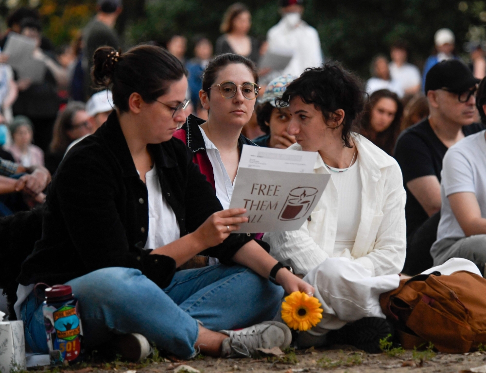 People gather in Meridian Hill Park for an interfaith rally and vigil in solidarity for Palestinians on October 7, 2024 in Washington, DC. Around the US groups of both Palestinian and Israeli supporters held memorials and demonstrations for the one year anniversary of Hamas's October 7 attack on Israel and the start Israel? military campaign in Gaza. — AFP
