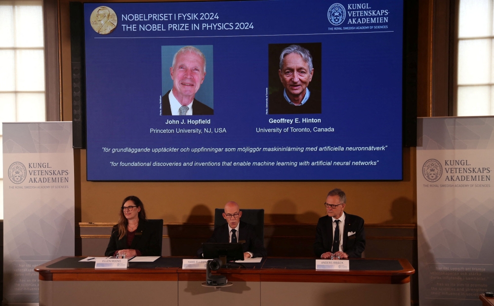 Professor Ellen Moons, Secretary General at the Swedish Academy of Sciences Hans Ellegren, and Professor Anders Irback during the announcement of John J Hopfield and Geoffrey E Hinton as this year's Nobel Prize winners in Physics in Stockholm, Sweden, October 8, 2024. — Reuters pic