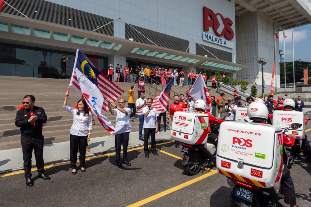 Communication Minister Fahmi Fadzil flags off Pos Malaysia's electric delivery vehicles at Pos Malaysia headquarters, Kuala Lumpur. October 9, 2024 — Picture by Raymond Manuel