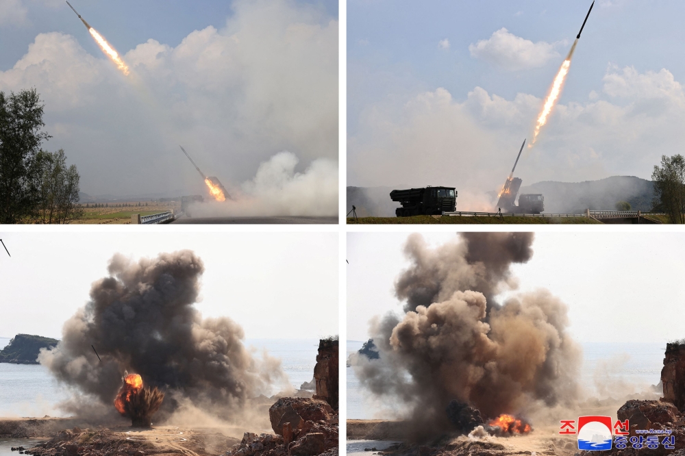 A combination picture shows what the Korean Central News Agency says is a test firing of 240mm guided artillery shells conducted by North Korea's Academy of National Defense Science at an undisclosed location in North Korea, October 8, 2024, in this photo released by North Korea's official Korean Central News Agency. — KCNA via Reuters pic
