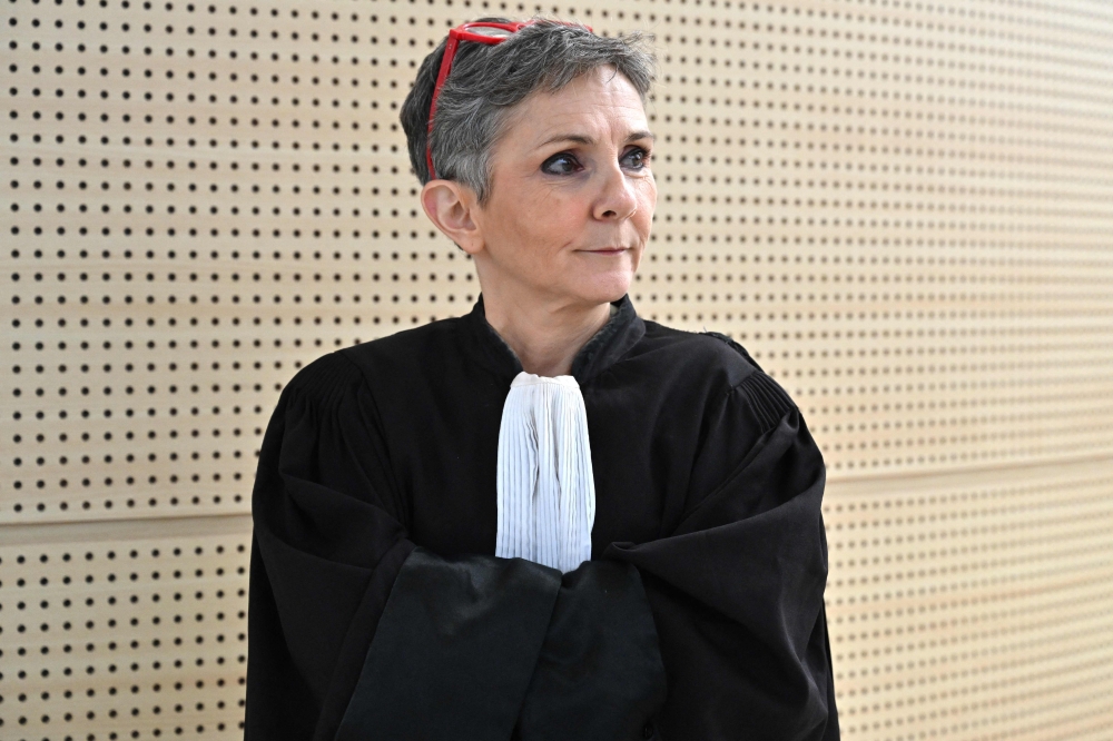 Beatrice Zavarro, lawyer of Dominique Pelicot accused of drugging his former partner Gisele Pelicot for nearly ten years and inviting strangers to rape her at their home in Mazan, a small town in the south of France, poses at the Avignon courthouse on October 2, 2024. — AFP pic