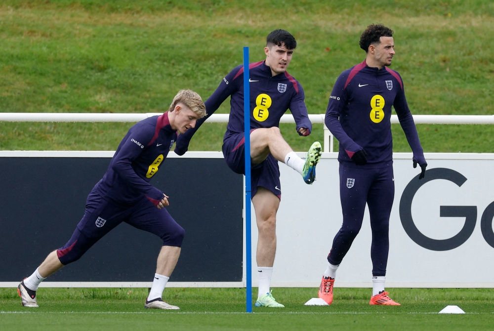 (Left to right) England's Anthony Gordon, Tino Livramento and Curtis Jones during training. — Reuters pic