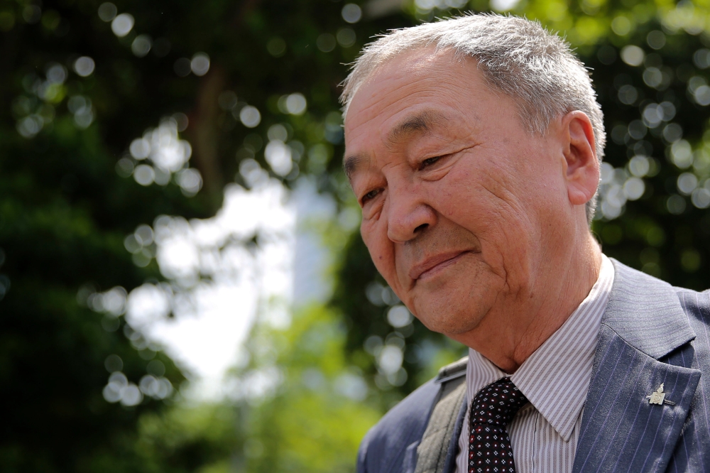 Kuala Lumpur, 20/06/2018. Dr Shaariibu Setev (centre) walks away after lodging a police report at Dang Wangi Police Station in Kuala Lumpur. Picture by  Yusof Mat Isa