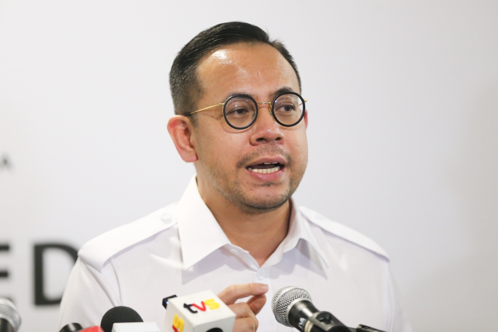 Home resources minister, Steven Sim said the report would guide industries and workers to navigate through the shocks that will come as more firms use AI and digitalisation to automate. — Picture by Miera Zulyana