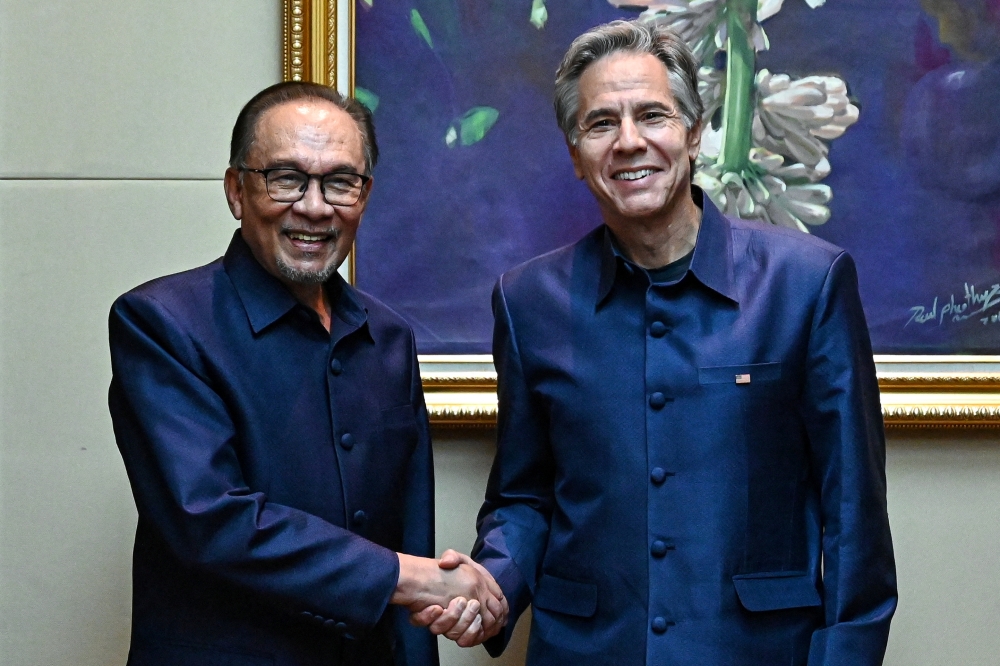 US Secretary of State Antony Blinken meets with Prime Minister Datuk Seri Anwar Ibrahim during the 44th and 45th Association of South-east Asian Nations (Asean) Summits in Vientiane October 10, 2024. — Reuters pic