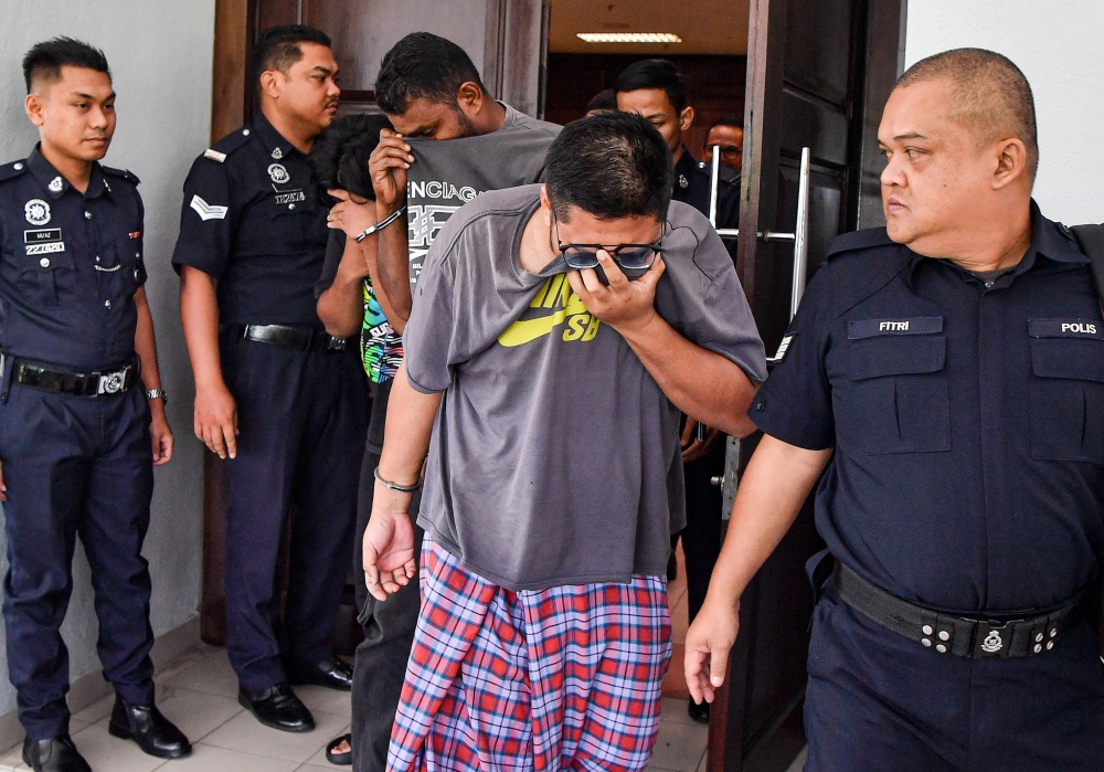 Muhammad Ilyas Jamaludin (2nd right) is charged with committing the offence of physically sexually assaulting a boy at the school in Tasik Senangin, Lenggeng from early to the end of last year. — Bernama pic