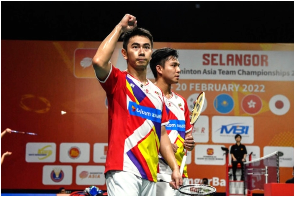 A file photograph shows Goh Sze Fei (left) and Nur Izzuddin celebrating a victory in Setia City Convention Centre, Shah Alam, on February 16, 2022. — Bernama pic