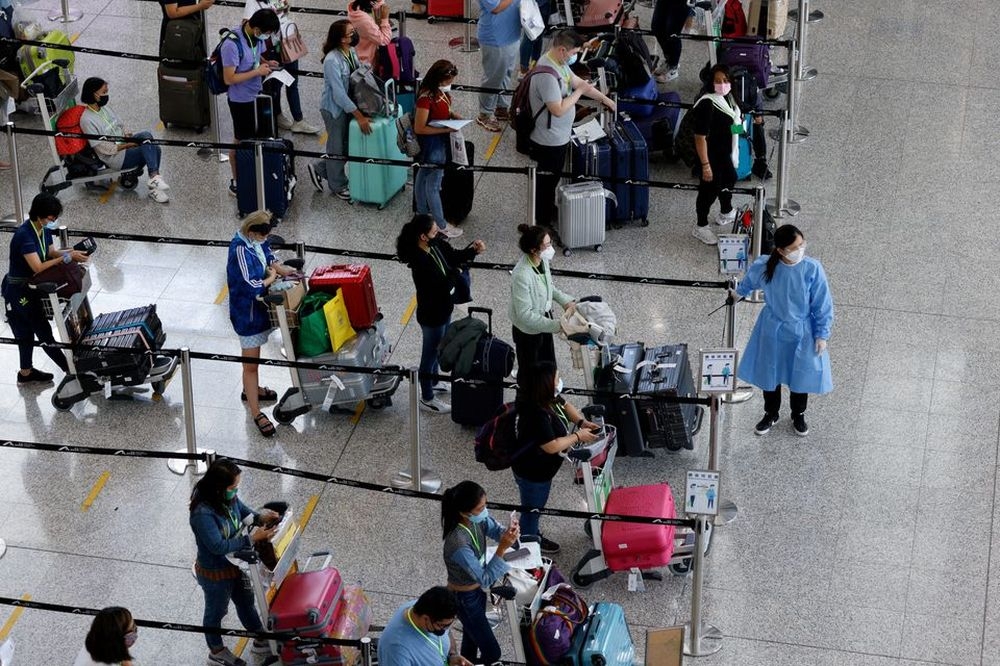 Travellers queue up for shuttle bus to quarantine hotels at the Hong Kong International Airport, amid the coronavirus disease (Covid-19) pandemic, in Hong Kong in this file photo taken on August 1, 2022. The number of thefts on flights to Hong Kong surged by 164 per cent in the first eight months of the year. — Reuters pic