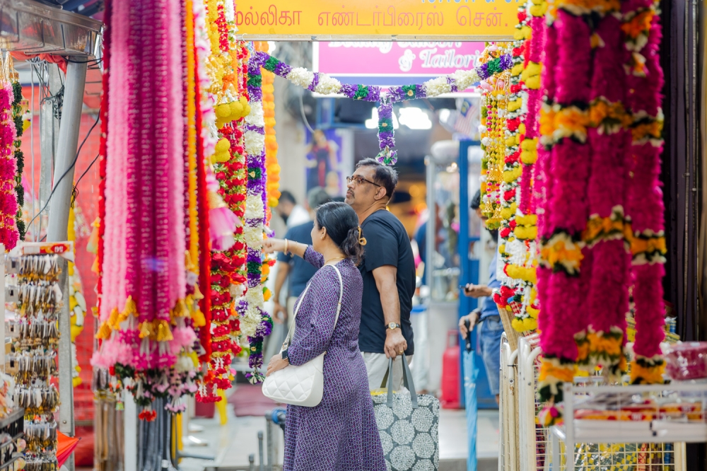 Shoppers browse colorful garlands and decorations for Deepavali in Brickfields, Kuala Lumpur October 2, 2024. — Picture by Raymond Manuel