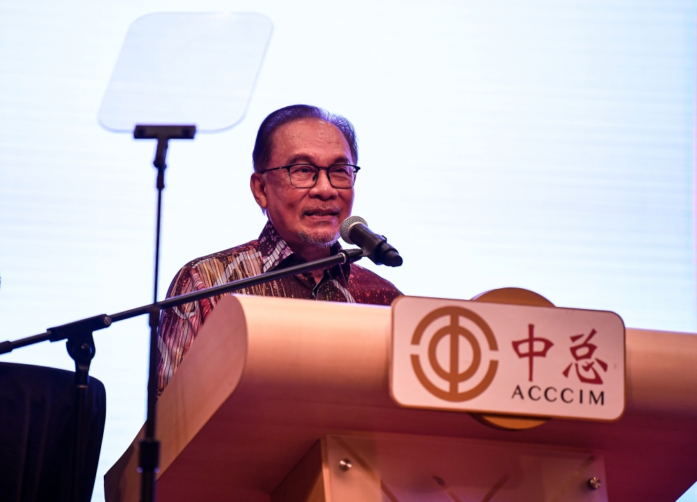 Prime Minister Datuk Seri Anwar Ibrahim speaks at the 78th AGM of the Association of Chinese Chambers of Commerce and Industry Malaysia (ACCCIM) at the One World Hotel in Petaling Jaya, Selangor on October 13, 2024. — Bernama pic