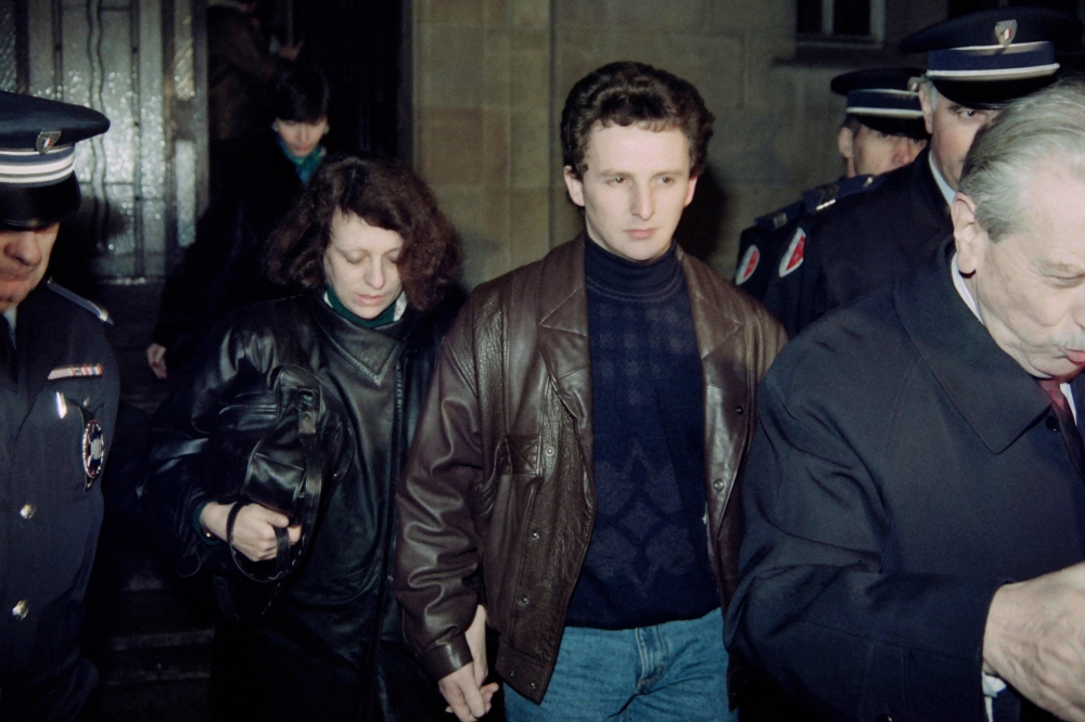 A file photograph shows Jean Marie (centre right) and Christine Villemin arrive for a second day of hearing with Judge Maurice Simon at the courthouse of Dijon on January 16, 1990. — AFP pic