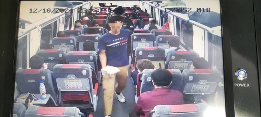 KTMB said its CCTV captured a passenger pulling the emergency brake on board to force the ETS ES9052 to stop, delaying the intercity train’s arrival to Ipoh in Perak by two hours. — Picture courtesy of KTMB
