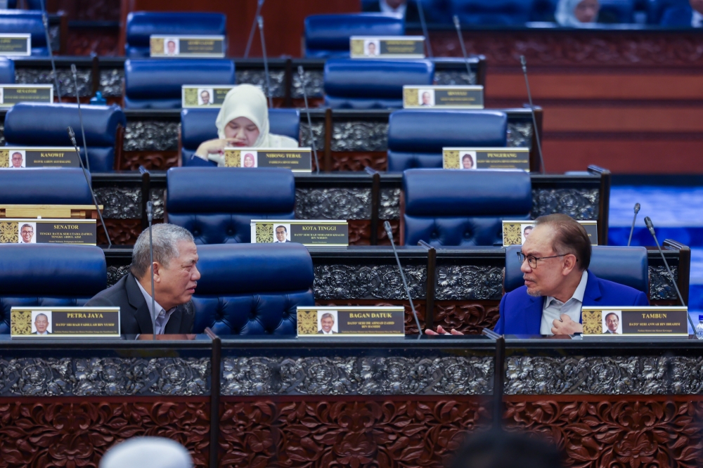 Prime Minister Datuk Seri Anwar Ibrahim (front, right) and Deputy Prime Minister Datuk Seri Fadillah Yusof (front, left) at the Dewan Rakyat in conjunction with the Third Meeting of the Third Term of the 15th Parliament at the Parliament in Kuala Lumpur October 14, 2024. — Bernama pic