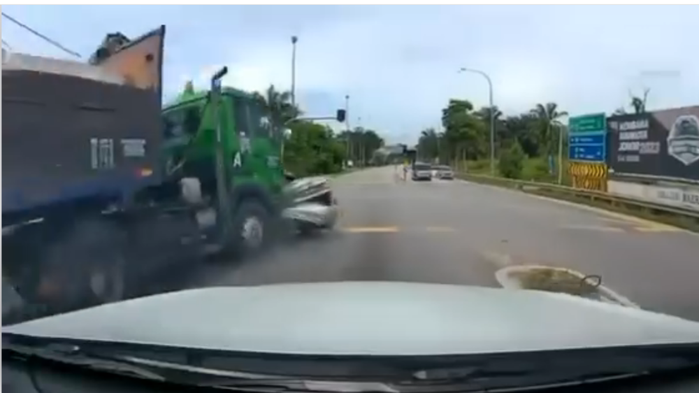 A screen capture from dashcam footage shows the lorry hitting a car at a junction in Batu Pahat, on October 13, 2024. 