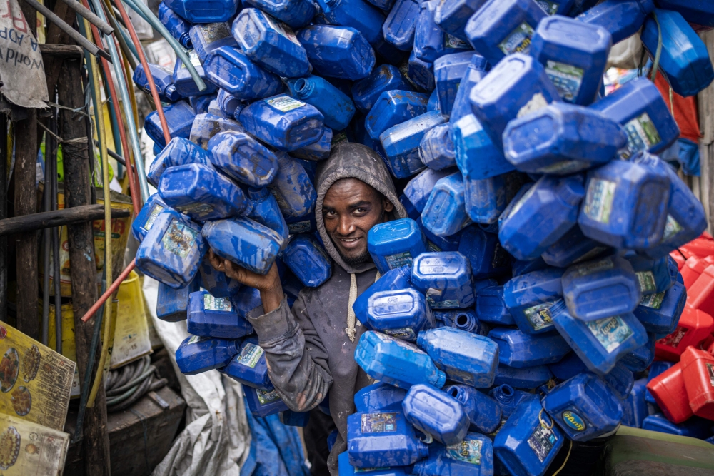 Ezedin Muste, 23 — an informal waste collector known in Amharic as ‘korale’ — moves a huge pile of plastic soap containers at the historical Merkato district of Addis Ababa October 1, 2024. ‘Korale’ is a made-up word in Amharic that is used for the thousands of collectors, almost all men, who hunt out everything from used jerry cans and electrical equipment to shoes, shovels and any other unwanted bric-a-brac. — AFP pic