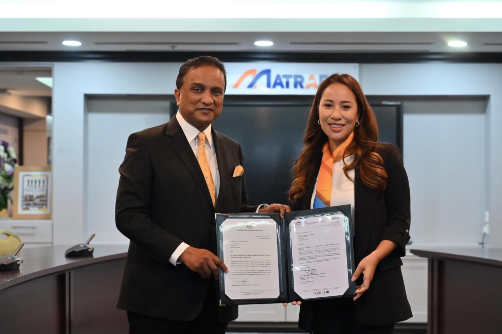 Datuk Seri Reezal Merican Naina Merican poses with Nooryana Najwa Najib after her appointment to the Matrade board of directors, at Menara Matrade in Kuala Lumpur on Oct 15, 2024. — Picture from Facebook/Reezal Merican Naina Merican