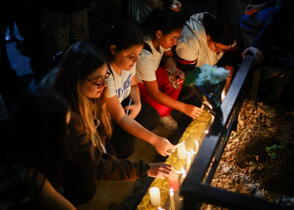 Fans place candles outside the hotel where Liam Payne, former One Direction member, was found dead, in Buenos Aires, Argentina. REUTERS/Agustin Marcarian — Reuters
