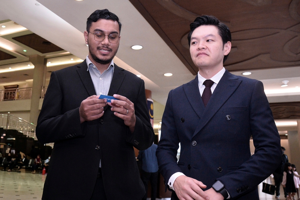 ‘Mentega Terbang’  director Khairi Anwar Jailani (left) and producer Tan Meng Kheng are pictured at the Magistrate’s Court in Kuala Lumpur January 17, 2024. — Bernama pic