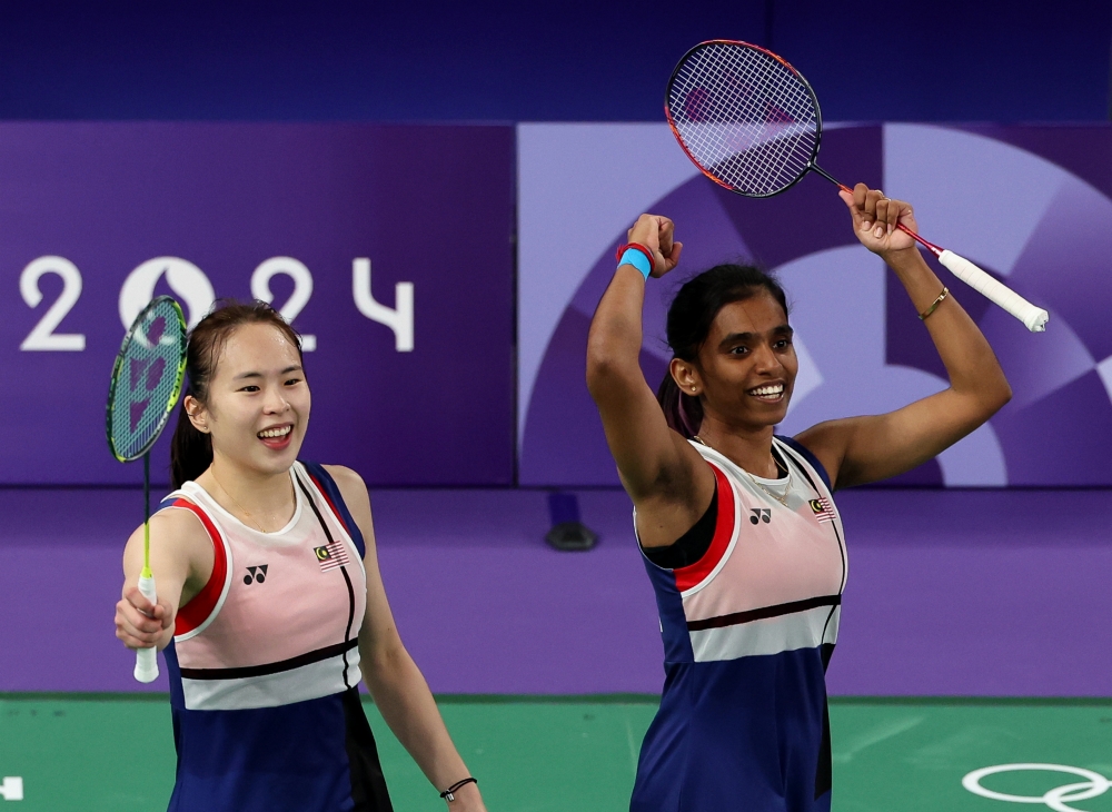 A file photograph shows  Pearly Tan and M Thinaah celebrating a victory at at Porte de La Chapelle Arena  in Paris, France on August 1, 2024. — Bernama pic